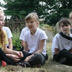 Children from Orchards Primary School told Tom Hickathirft's story at his grave